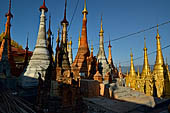 Inle Lake Myanmar. Indein, on the summit of a hill the  Shwe Inn Thein Paya a cluster of hundreds of ancient stupas. Many of them are ruined and overgrown with bushes. 